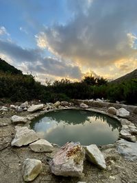 Scenic view of lake against sky during sunset