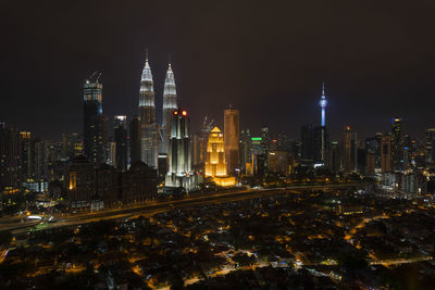 View of skyscrapers lit up at night