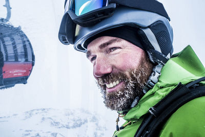 Close-up of smiling man wearing helmet