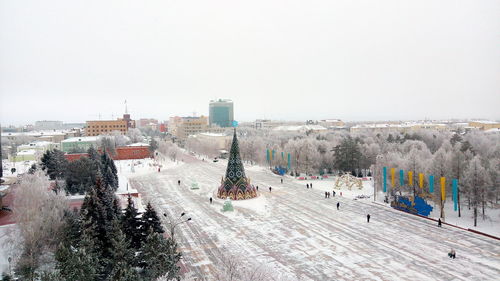 High angle view of buildings in city against clear sky