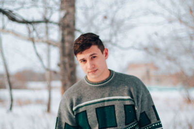 Portrait of a boy standing in snow