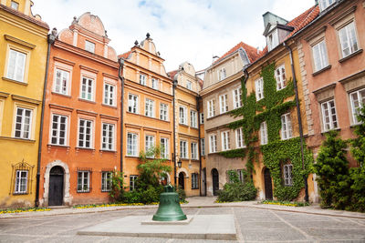 Street amidst buildings against sky