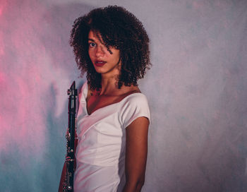 Portrait of young woman playing piano