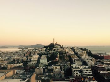 Cityscape against sky during sunset