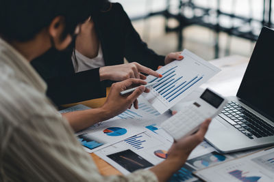 Midsection of woman using mobile phone