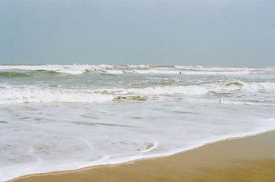 Scenic view of beach against clear sky