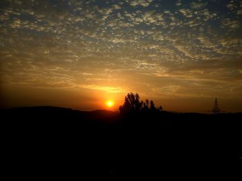 Scenic view of silhouette landscape against sky during sunset