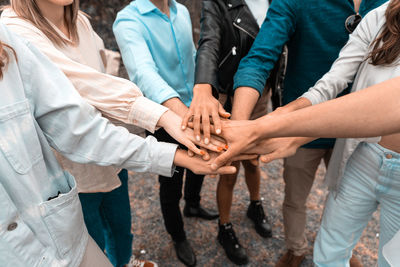 Low section of people standing by bare feet