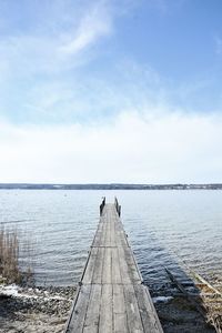 Pier over sea against sky