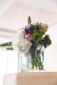 Close-up of flower vase on table