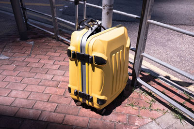 High angle view of yellow bicycle on footpath