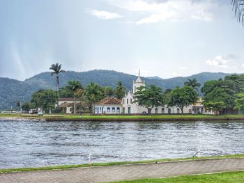 View of river with houses in background