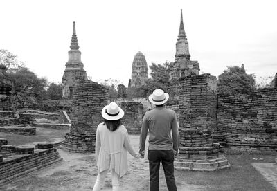 Monochrome image of young couple visiting temple ruins in the ayutthaya historical park, thailand