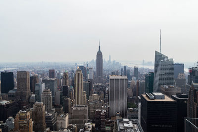 Modern buildings in city against sky