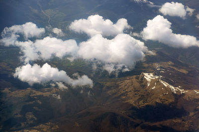 View from above through clouds on a mountain valley in early spring. caucasus mountains, georgia