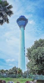 Low angle view of tower against cloudy sky