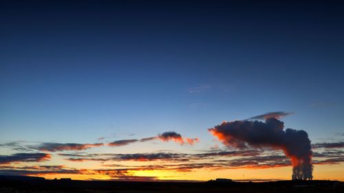 Silhouette man against sky during sunset