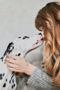 Midsection of woman holding dog