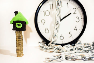 Close-up of clock on table