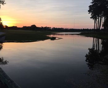 Scenic view of calm sea at sunset