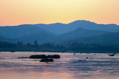 Scenic view of mountains against sky during sunset