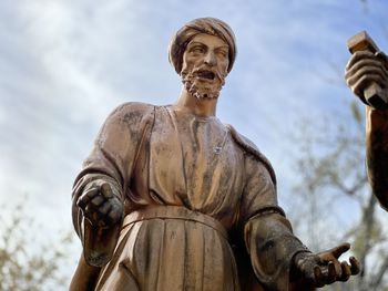 Low angle view of statue against sky