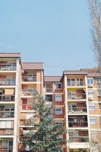 Low angle view of buildings against clear sky