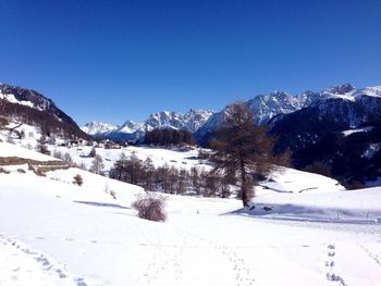 Scenic view of snowy landscape against sky