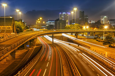 Illuminated city street at night