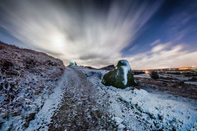 Scenic view of snow covered mountain against sky