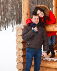 Portrait of happy couple in snow