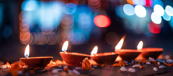 Lit candles in temple at night