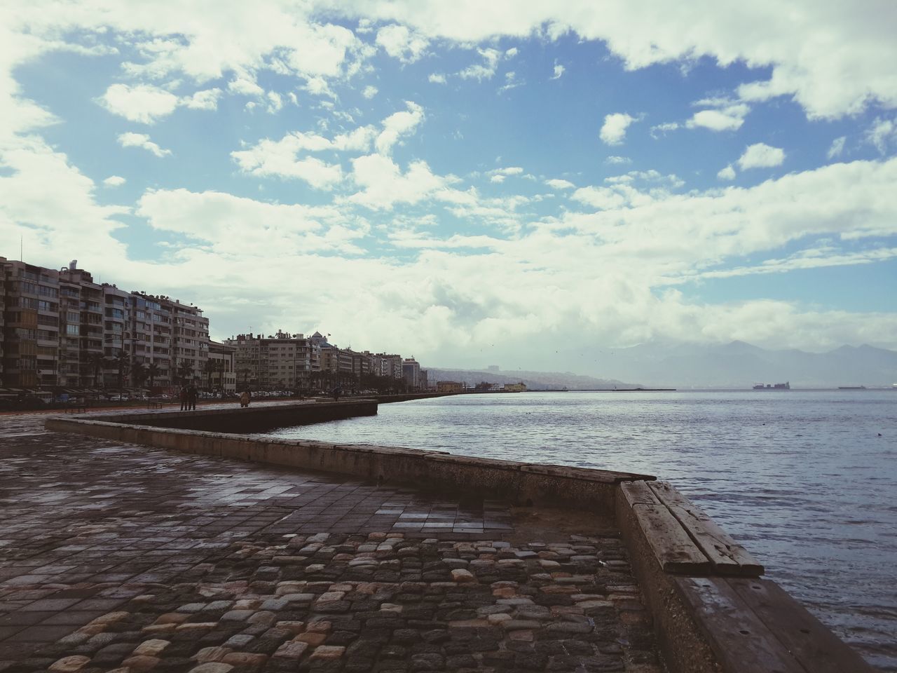 water, built structure, architecture, sky, building exterior, sea, cloud - sky, cloudy, cloud, pier, river, day, horizon over water, outdoors, nature, tranquility, rippled, no people, railing, tranquil scene