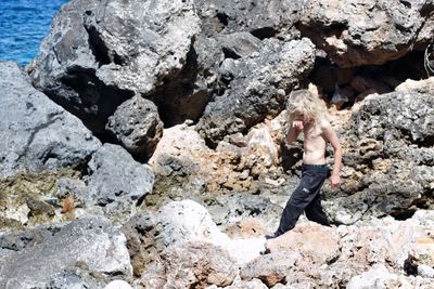 Woman standing on rock