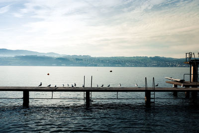 Pier over sea against sky