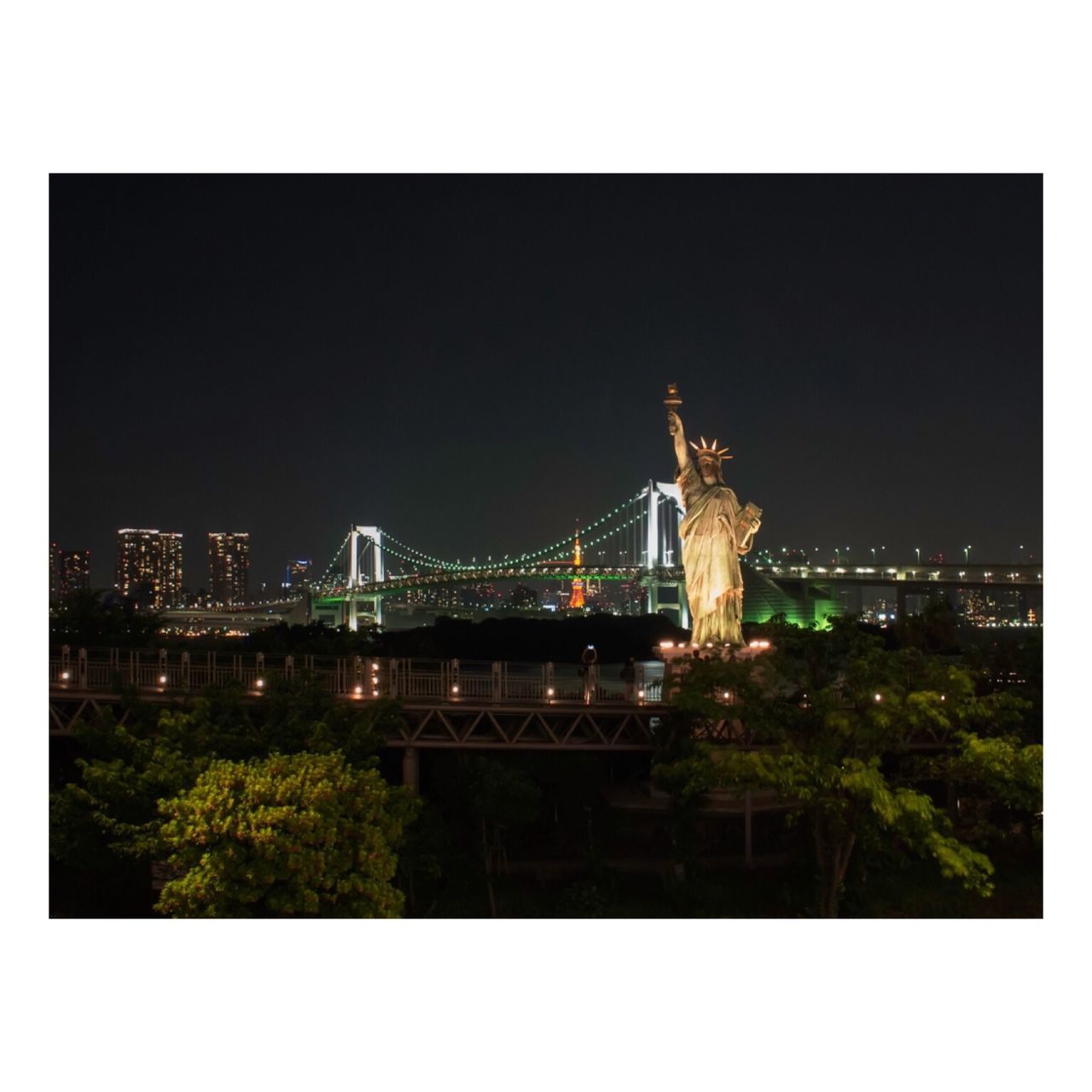 architecture, built structure, transfer print, building exterior, night, illuminated, connection, bridge - man made structure, auto post production filter, copy space, city, engineering, clear sky, sky, bridge, river, travel destinations, outdoors, cityscape, suspension bridge