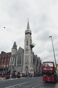 Low angle view of cathedral against cloudy sky