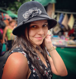 Portrait of young woman wearing hat