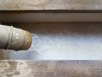 Close-up of water pipe against wall