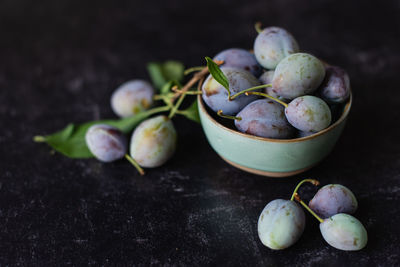 Close-up of fruits in bowl on table