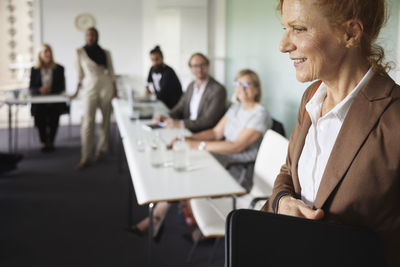 Smiling businesswoman at meeting