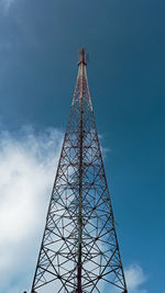 Low angle view of communications tower against sky