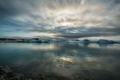 Scenic view of sea against sky during winter