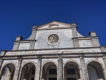 Low angle view of cathedral against clear blue sky