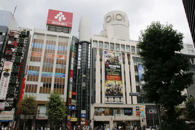 Low angle view of buildings in city against sky