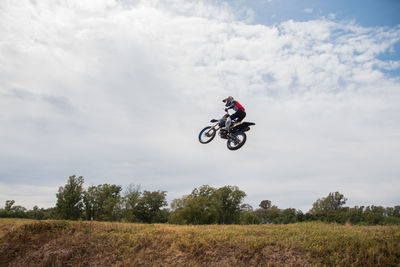 Motocross race rider jumping