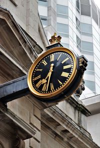 Black and gold clock in the city