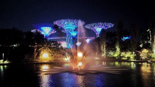 Reflection of illuminated buildings in water at night