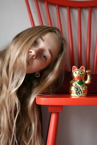 Close-up portrait of young woman on table