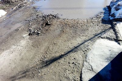 High angle view of puddle on road